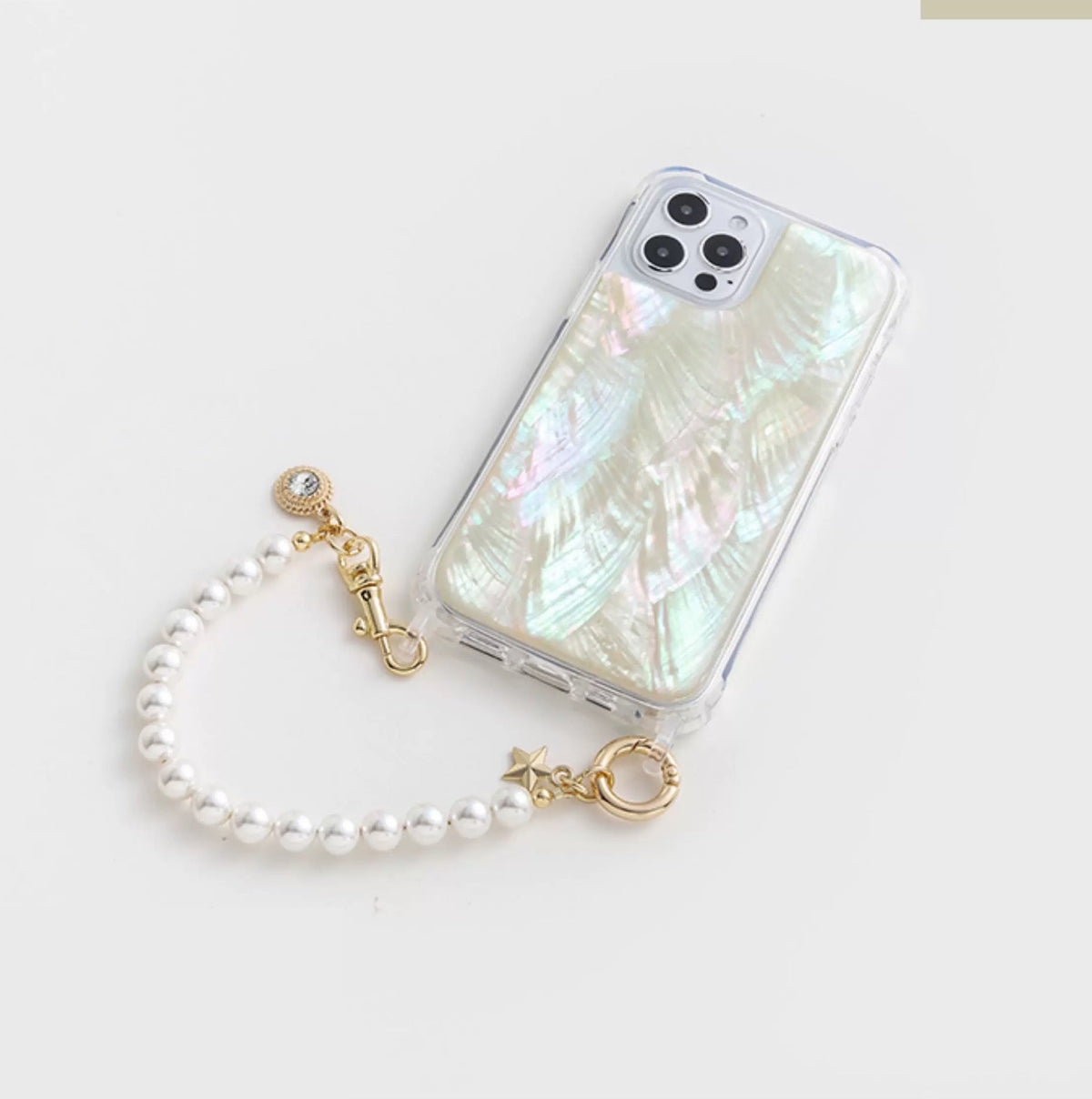 Phone case with pearl charm on a white background from London based gemstone jewellery designer WJY studio